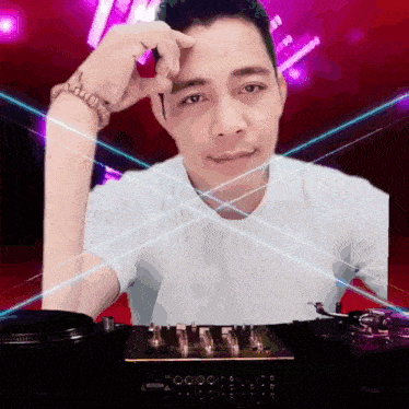 a man in a white shirt stands in front of a mixer