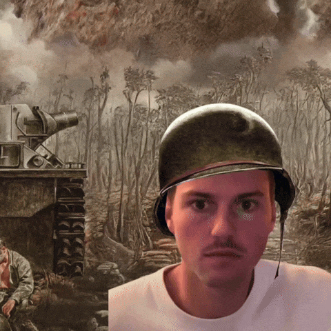 a man wearing a helmet in front of a painting