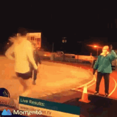 a person running in front of a sign that says live results momento