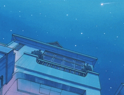 a building with a balcony and a shooting star in the sky above it