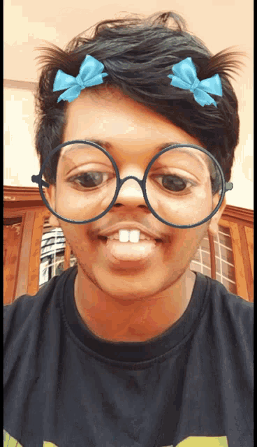 a person wearing glasses and bows on their head