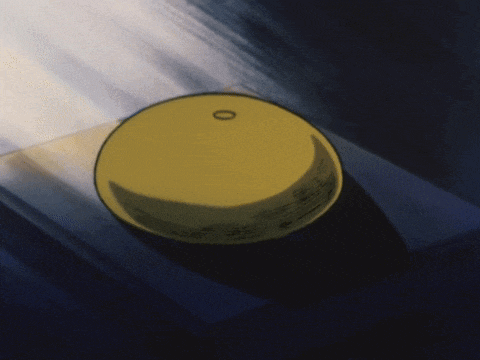 a yellow object with a circle in the middle