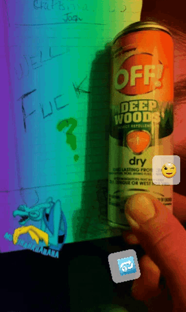 a person is holding a can of off deep wood dry