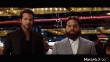 a man with a beard is standing next to another man with a beard ..