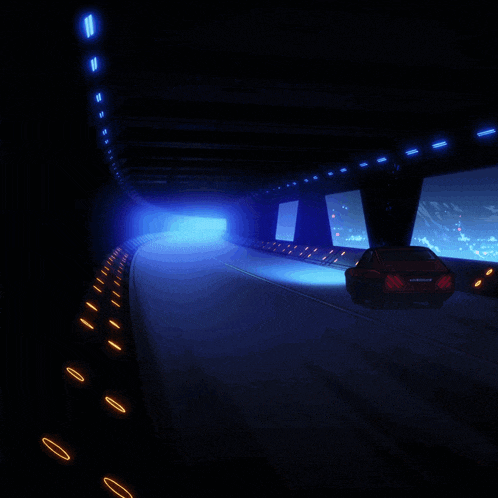 a car is driving through a dark tunnel with a blue light