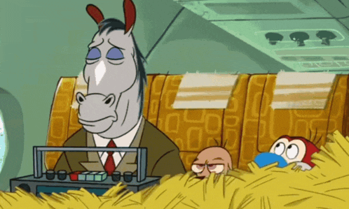 a horse in a suit and tie is sitting in a tray of hay