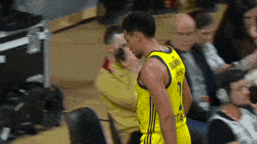 a basketball player wearing a number 2 jersey