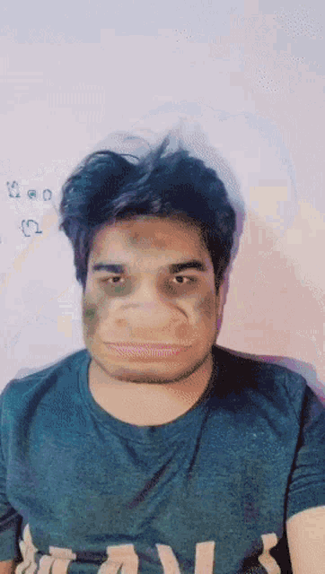 a man wearing a shirt that says ' abercrombie & fitch ' on it is making a funny face