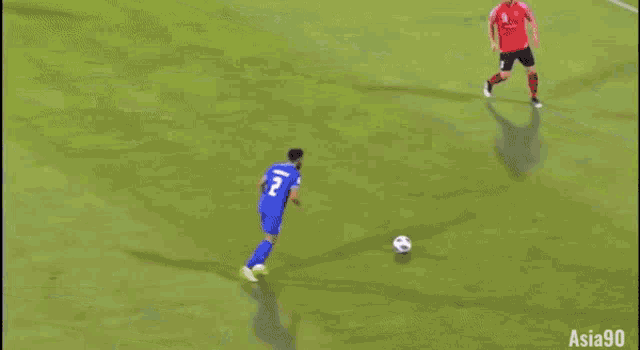 a soccer goalie tries to stop a ball from going into the goal