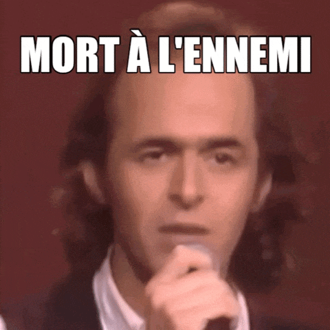 a man singing into a microphone with the words " mort a l' ennemi " written above him