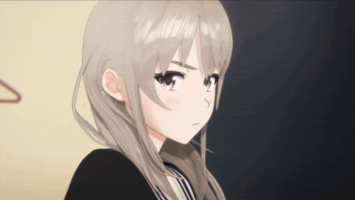 a close up of a girl 's face with a serious expression
