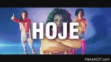 a group of women are dancing in front of a sign that says " hoje "