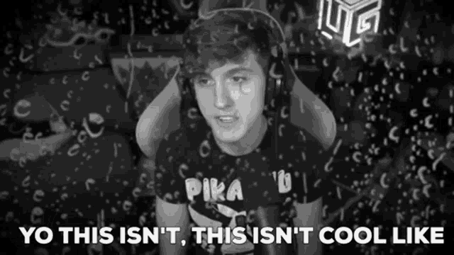 a black and white photo of a boy wearing headphones and a pika t-shirt