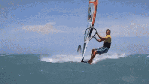 a man is riding a wave on a surfboard in the ocean