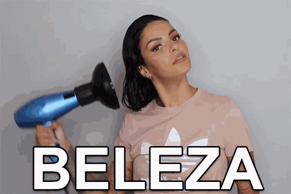 a woman holding a hair dryer with the word beleza written on the bottom