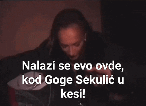 a woman holding a trophy with the words nalazime evo ovde kod goge sekulic u kesi written below her