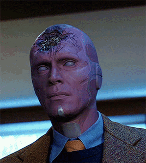 a man wearing a suit and tie has a purple face painted on his face