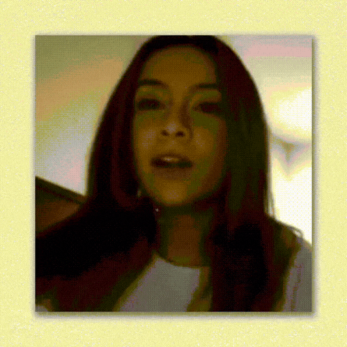 a close up of a woman 's face in a yellow frame