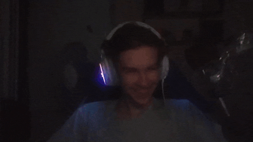 a man wearing headphones is making a funny face .