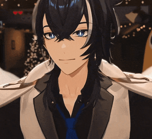 a man with long black hair and blue eyes is wearing a tuxedo