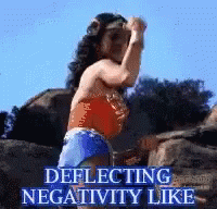 Wonderwoman Defelecting GIF - Wonderwoman Defelecting Negativity GIFs