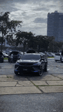 a black car is parked in a parking lot and has a license plate that says jc - jc - sd