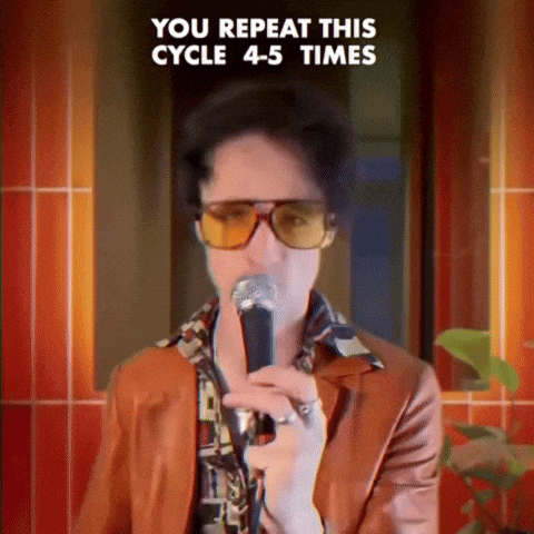 a man singing into a microphone with the words you repeat this cycle 4-5 times