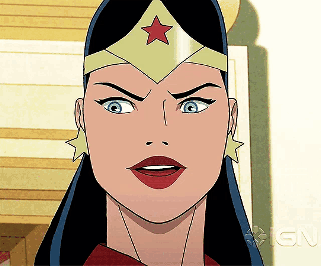 a close up of wonder woman 's face with an ign logo in the background