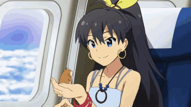 a girl with long black hair is holding a small animal