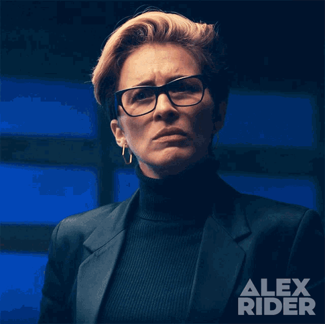 a woman wearing glasses and a black turtleneck with alex rider written on the bottom