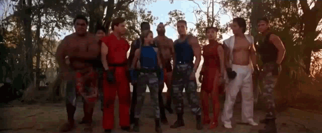 a group of people are posing for a picture and one of them is wearing a red shirt