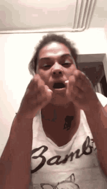 a woman wearing a bambi t-shirt is making a funny face