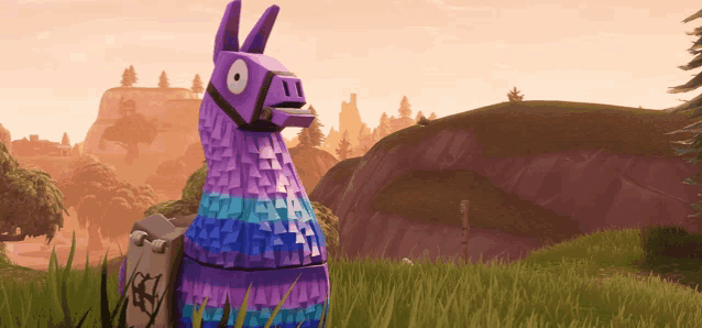 a purple and blue llama standing in a field