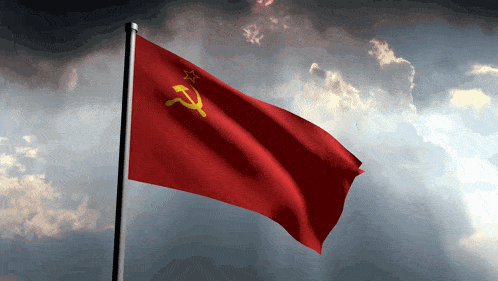 a red flag with a yellow star and hammer and sickle on it