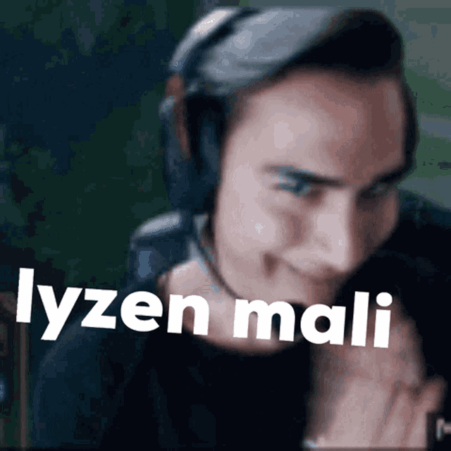 a man wearing headphones with the words lyzen mali written on his face
