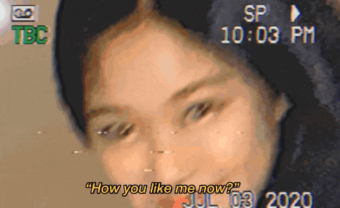 a close up of a woman 's face with the words " how you like me now " on the bottom