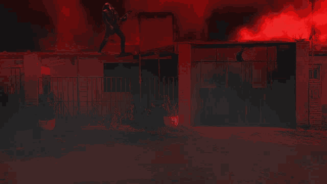a person standing on the roof of a building with lightning strikes