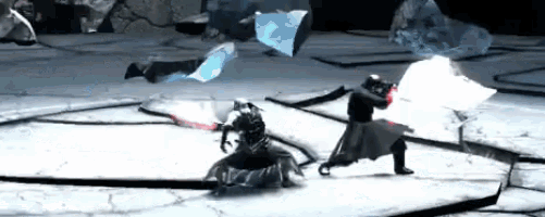two men are fighting with lightsabers on a stage .