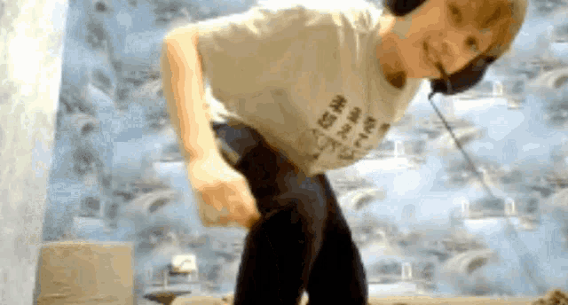 a man wearing headphones and a t-shirt that says ' i love you '