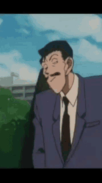 a man in a suit and tie is making a funny face while standing in front of a building .