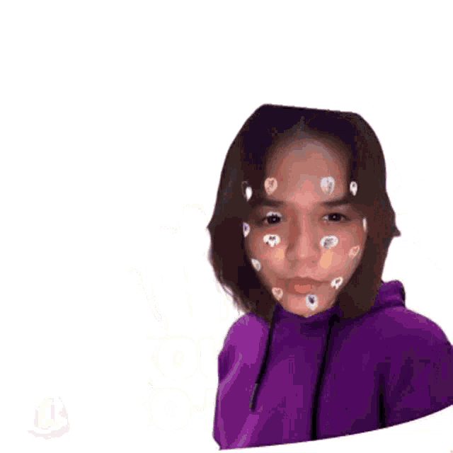 a girl with hearts on her face is making a stop gesture with her hand