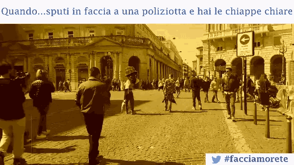 a photo of people walking down a street with the caption quando ... sputi in faccia