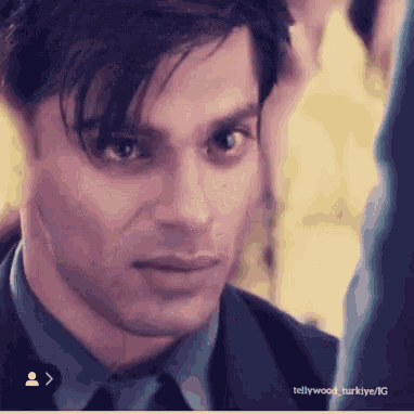 a close up of a man 's face with the words tellywood turkeye / ig at the bottom