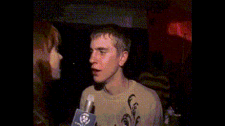 a man is talking to a woman with a microphone and the words i 'm low on sodium are above him