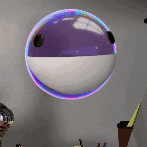 a purple and white ball with a black hole in it