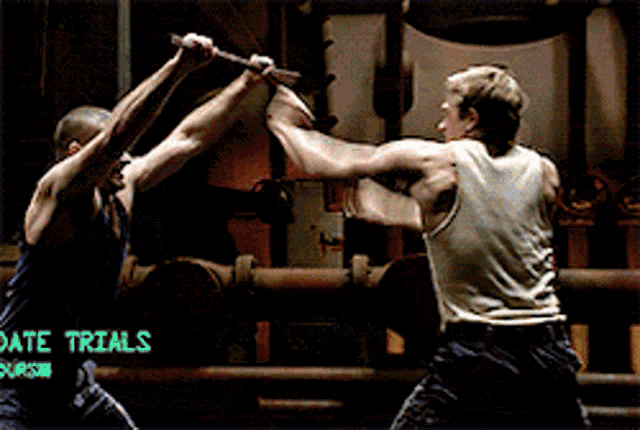 two men are fighting in a room with the words " live trials " on the bottom right