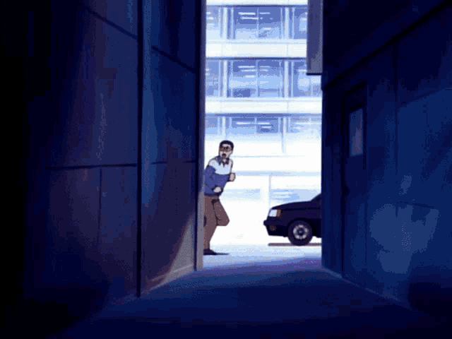 a man in a blue shirt is standing in a dark alleyway