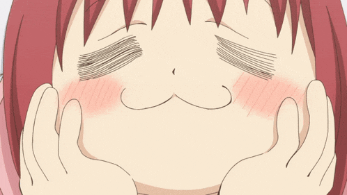 a girl with red hair is making a funny face with her hands
