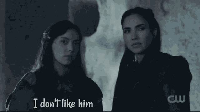 two women are standing next to each other and one of them is saying i don t like him