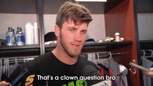 a man in a locker room talking into a microphone with the words that 's a clown question bro